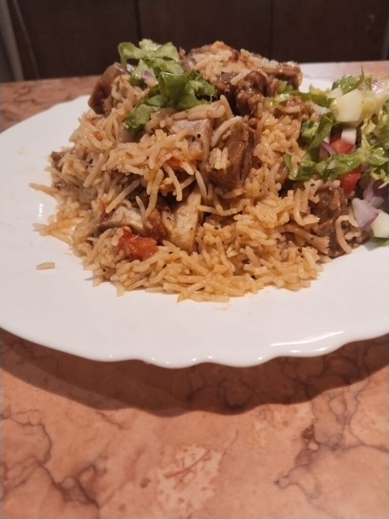 Mutton Yakhni Pulao served in a traditional platter with tender mutton and fragrant basmati rice